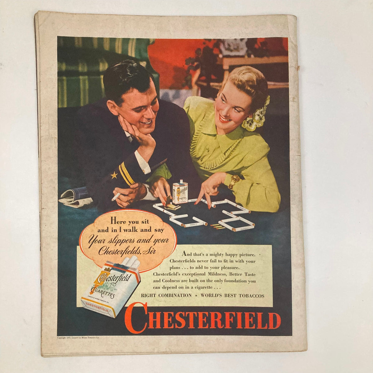 A colorful Chesterfield cigarette advertisement depicting a couple enjoying a playful moment while promoting various cigarette products. This image is part of the Saturday Evening Post Magazine February 10, 1945.