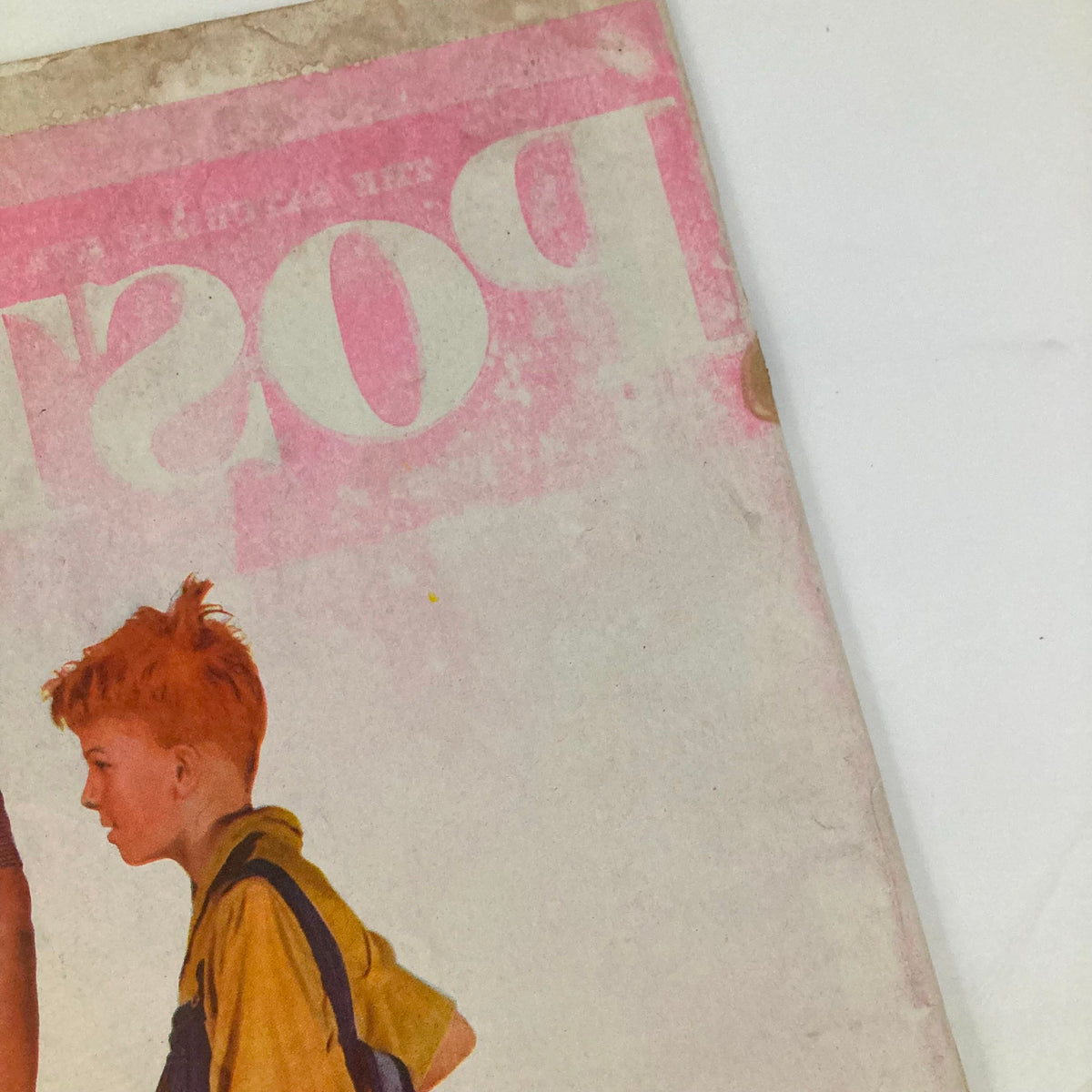 Close-up of the cover of the Saturday Evening Post Magazine June 29, 1946, highlighting a young boy in yellow and a man preparing for their golf game.