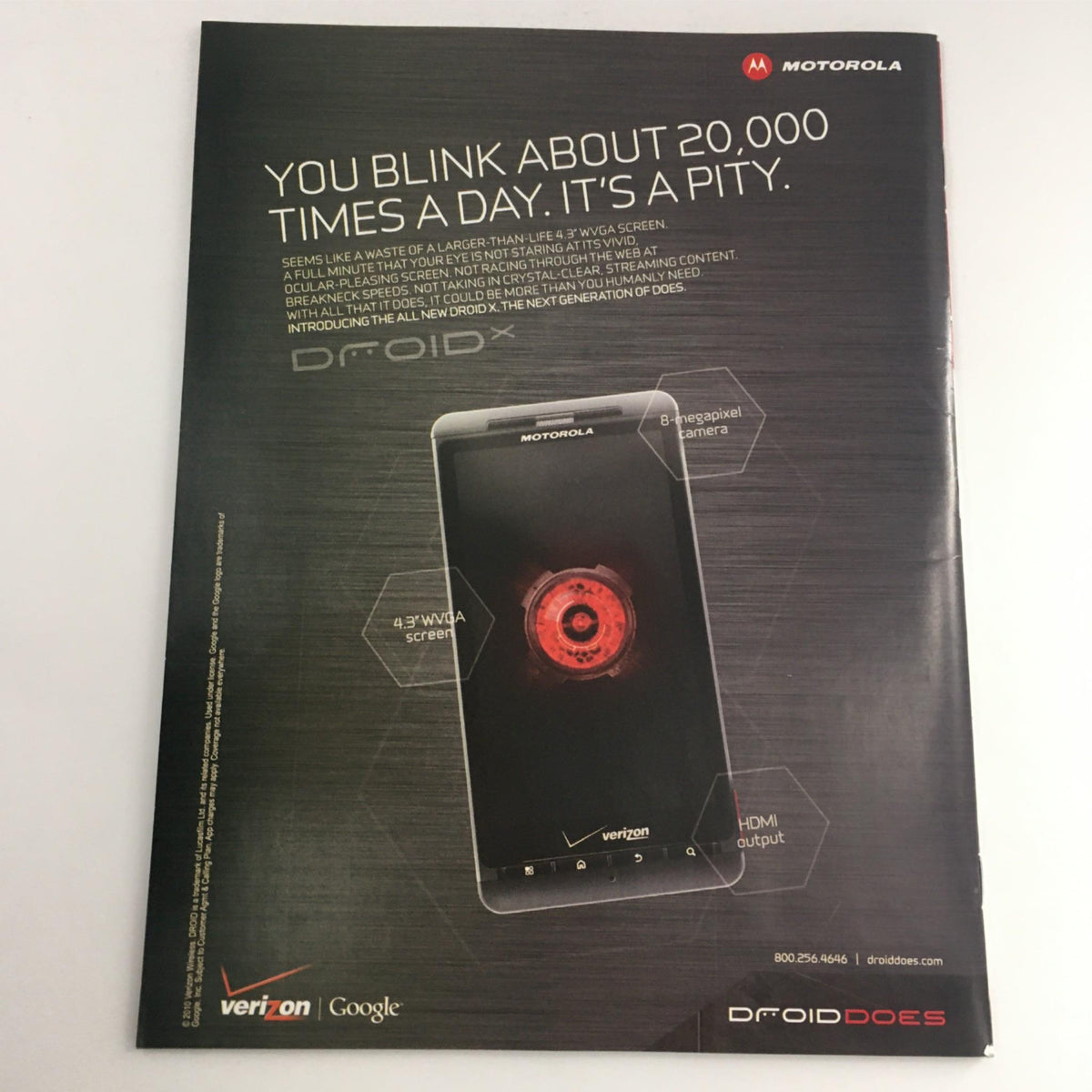 Advertisement for Motorola Droid smartphone, featured in Sports Illustrated Magazine July 19, 2010. Promotes its features like 3.7'' display and HDMI output.