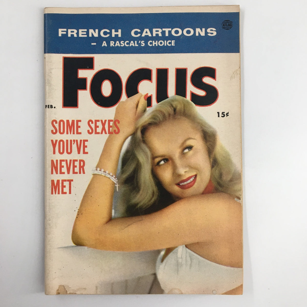 Cover of VTG Focus Magazine February 1956 featuring the title 'The Improved Blonde Girl', showcasing a blonde woman in a vintage style.