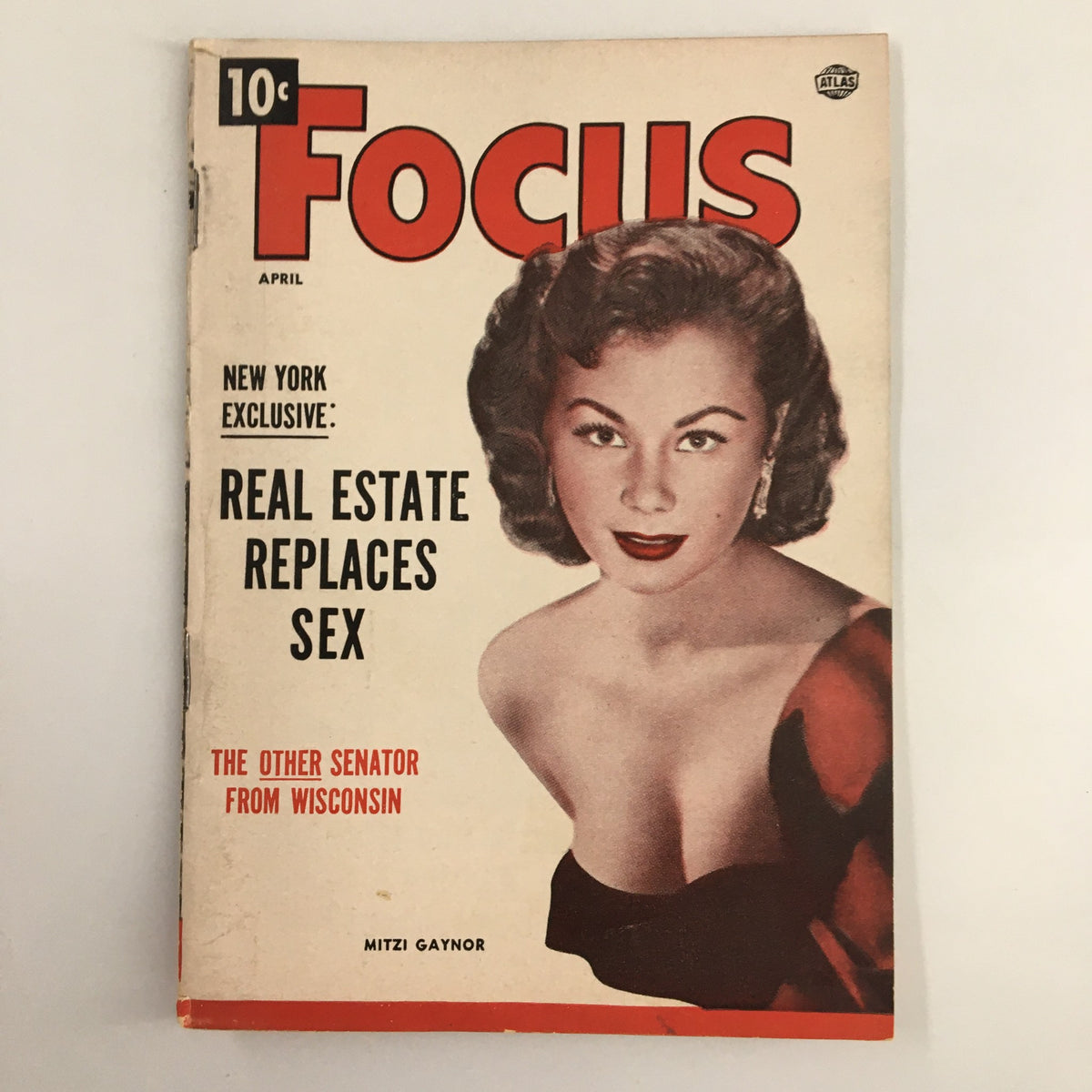 Cover of VTG Focus Magazine April 1954 featuring Mitzi Gaynor, showcasing headlines about real estate and Manhattan.