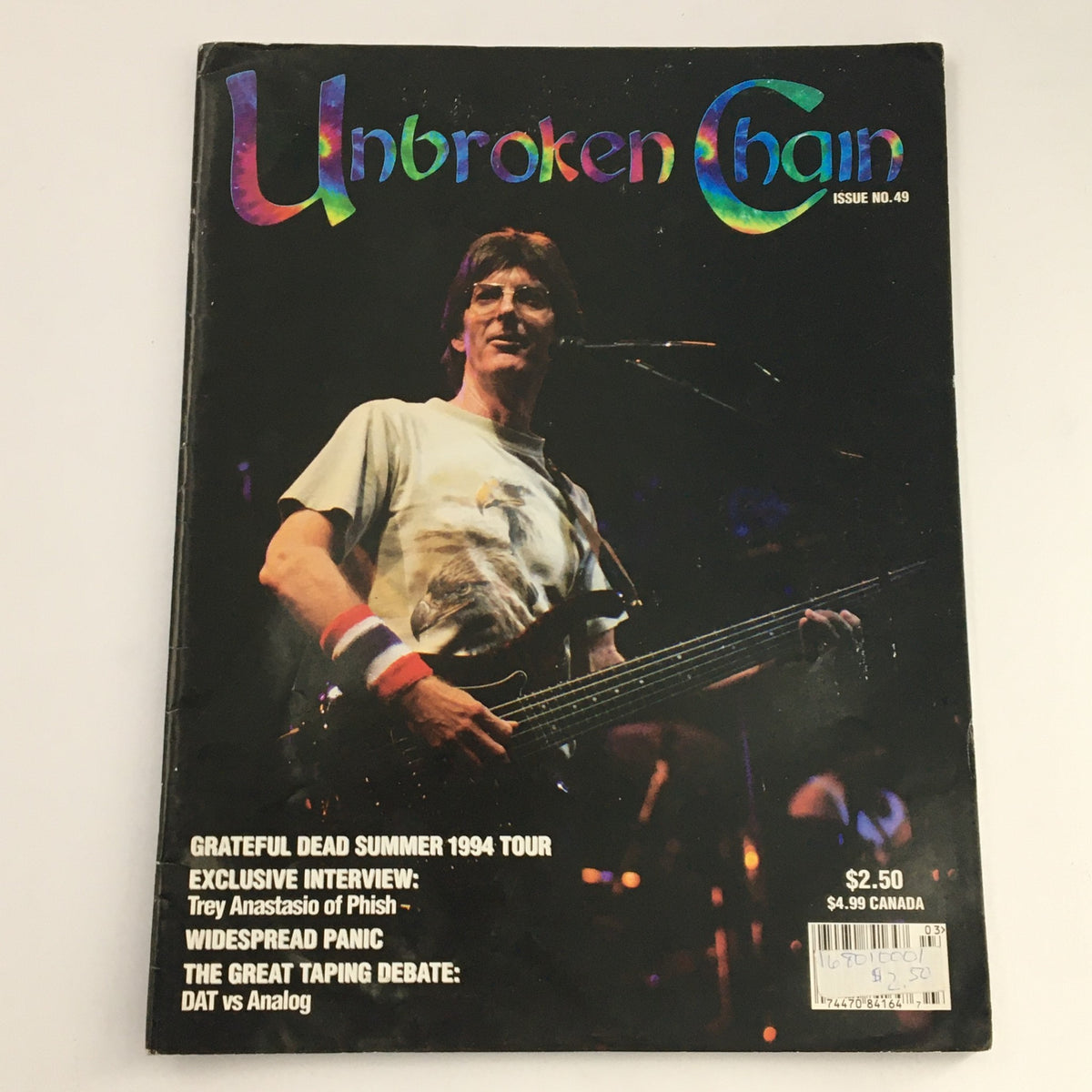 Cover of Unbroken Chain Magazine #49, dated September-November 1994, featuring Phil Lesh during 'Box of Rain'. The magazine highlights the Grateful Dead Summer 1994 Tour and includes articles and interviews related to Americana music.