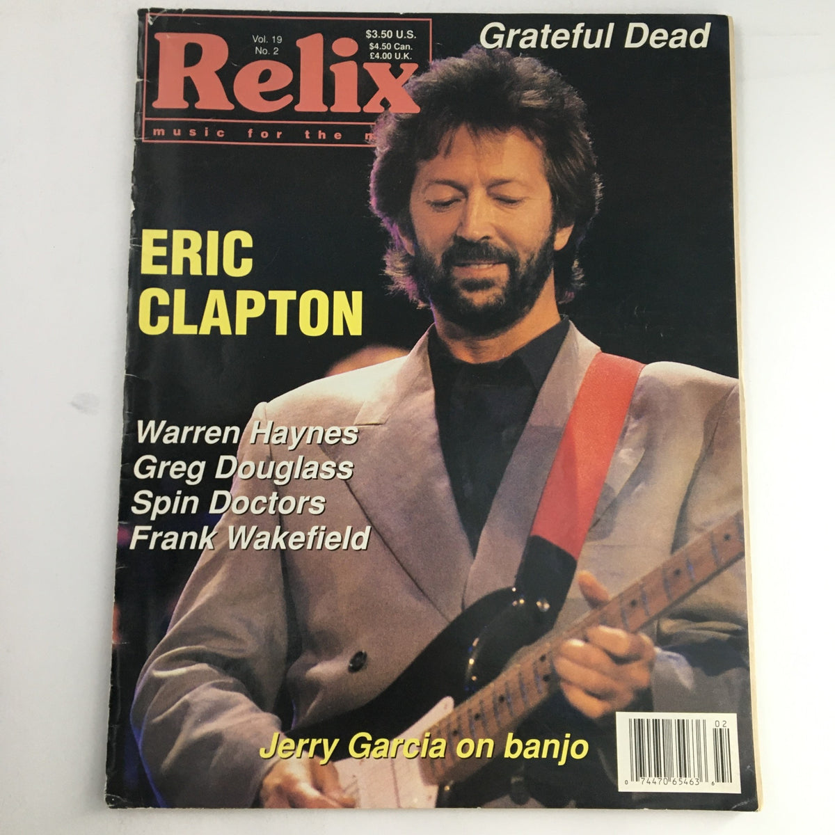 Relix Magazine April 1992 Vol 19 #2 featuring Eric Clapton on the cover, showcasing his iconic performance style. The magazine also includes mentions of artists like Warren Haynes and Jerry Garcia, reflecting the vibrant music scene of the 1990s.