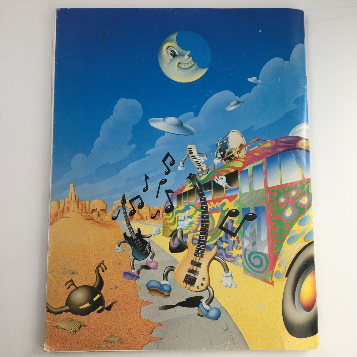 Cover image of The Golden Road Issue 27 1993 Annual, illustrated with a colorful scene of a psychedelic bus, guitars, and music notes, representing the spirit of the Deadheads Tour & Jerry Garcia Emergency.
