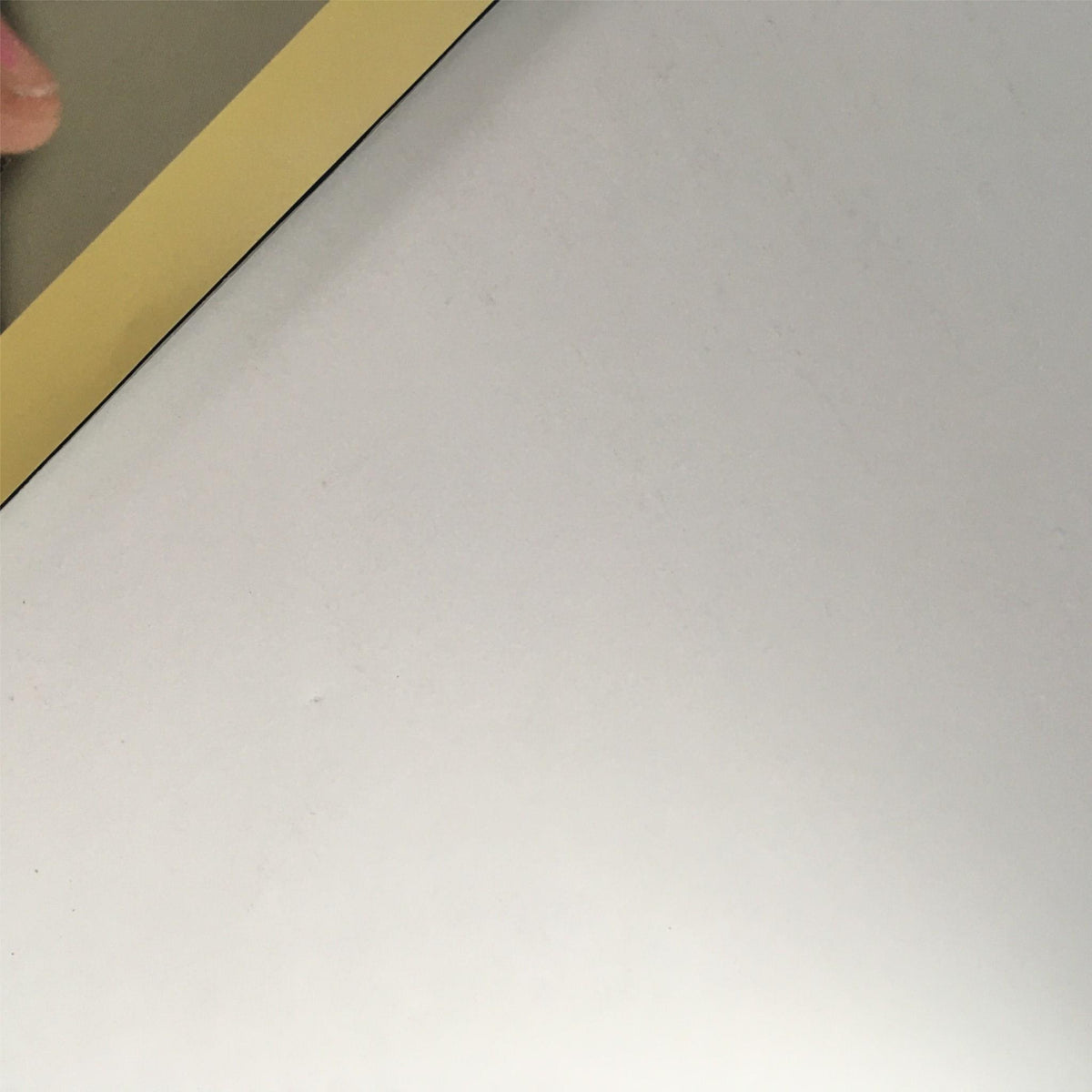 Close-up of the edge of Hoop Magazine 2009-2010 Greatest Hits, highlighting the magazine's vintage condition with minimal wear.
