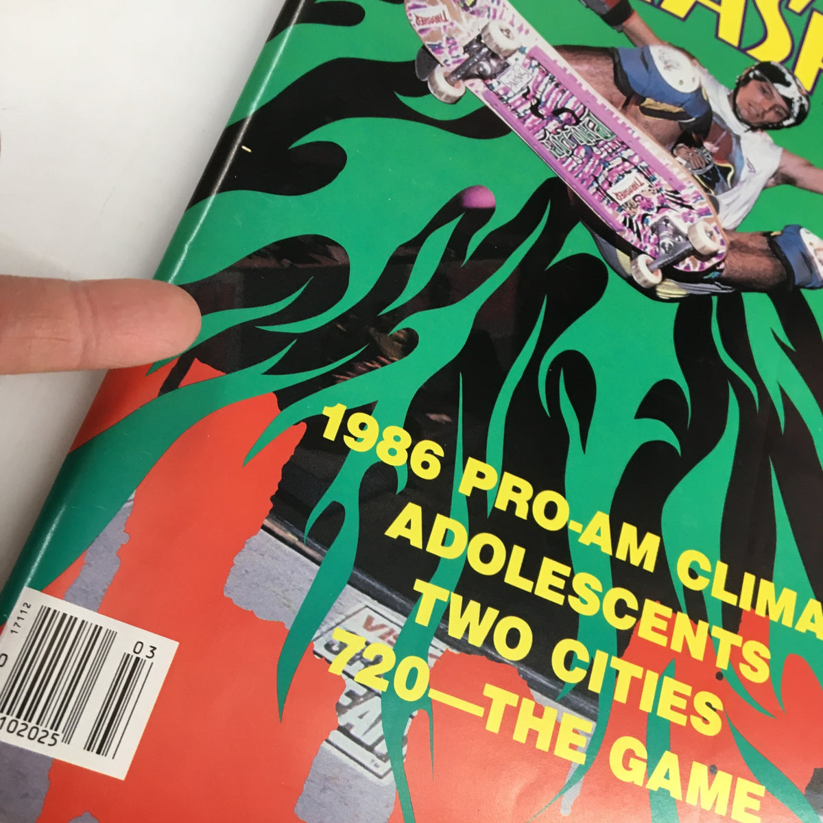 Close-up of the VTG Thrasher Magazine March 1987 cover highlighting Jeff Phillips' Ollie flight and vibrant graphics.