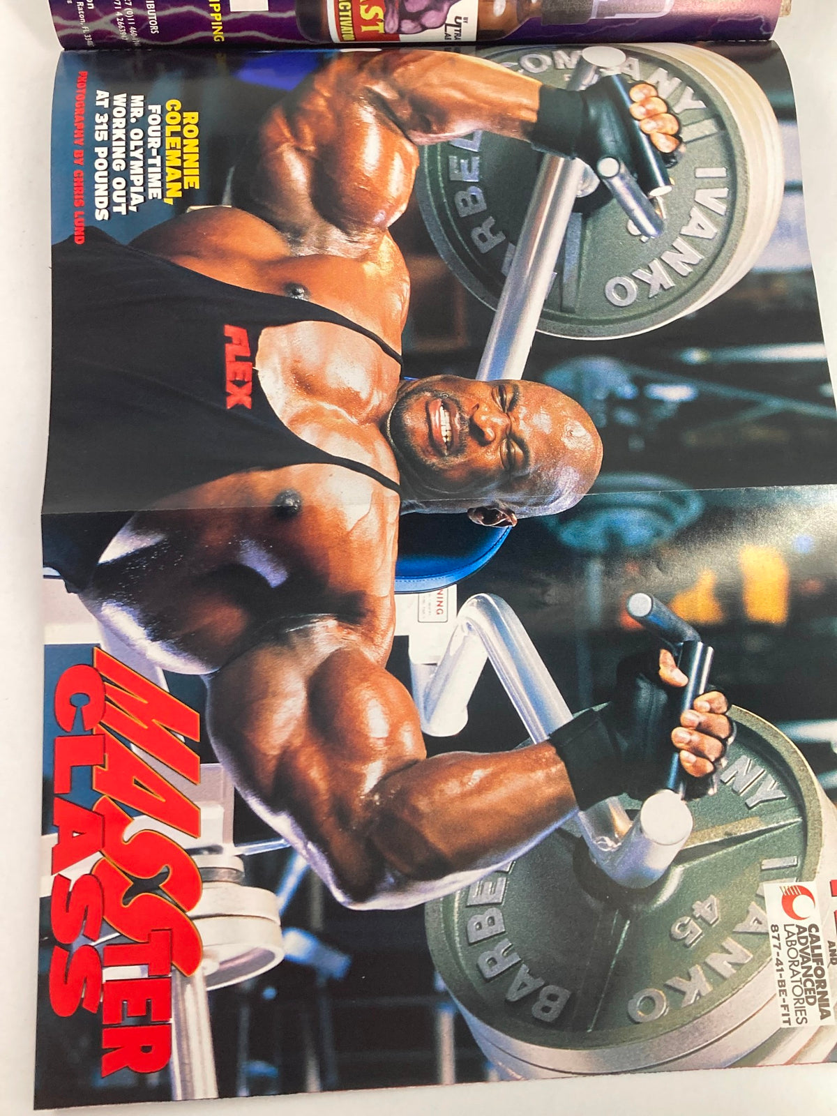 Flex Magazine January 2002 cover image of Ronnie Coleman performing an impressive exercise with weights, highlighting his powerful physique and dedication to bodybuilding.