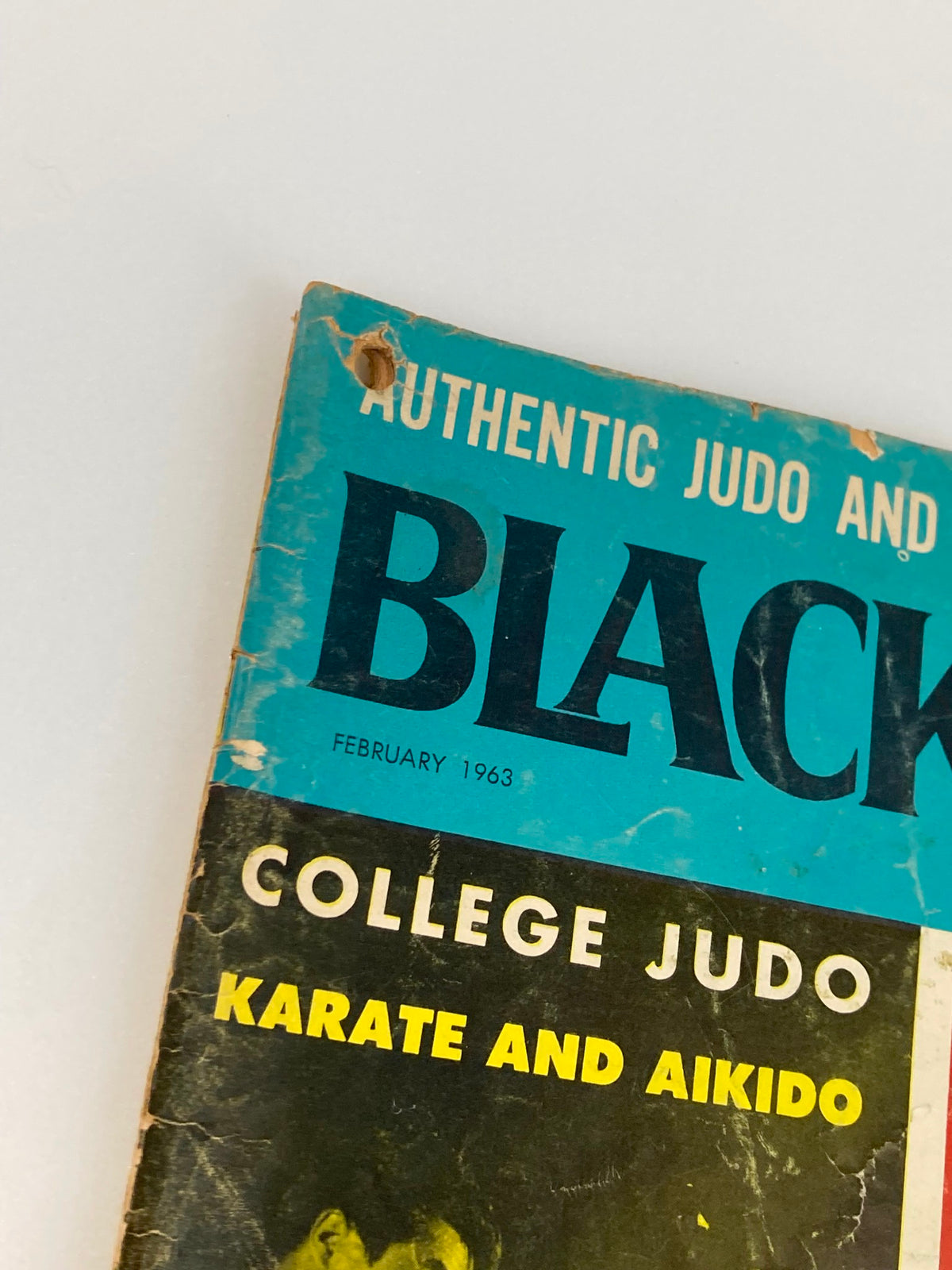 Close-up view of the top corner of VTG Black Belt Magazine February 1963, highlighting the title and details of 'College Judo, Karate and Aikido'.
