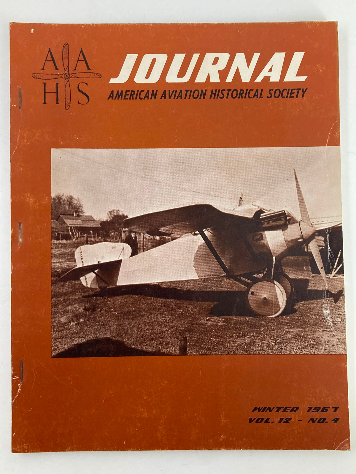 Cover of VTG American Aviation Historical Society Journal Winter 1967 Vol 12 No. 4 featuring an historic aircraft against an orange backdrop.