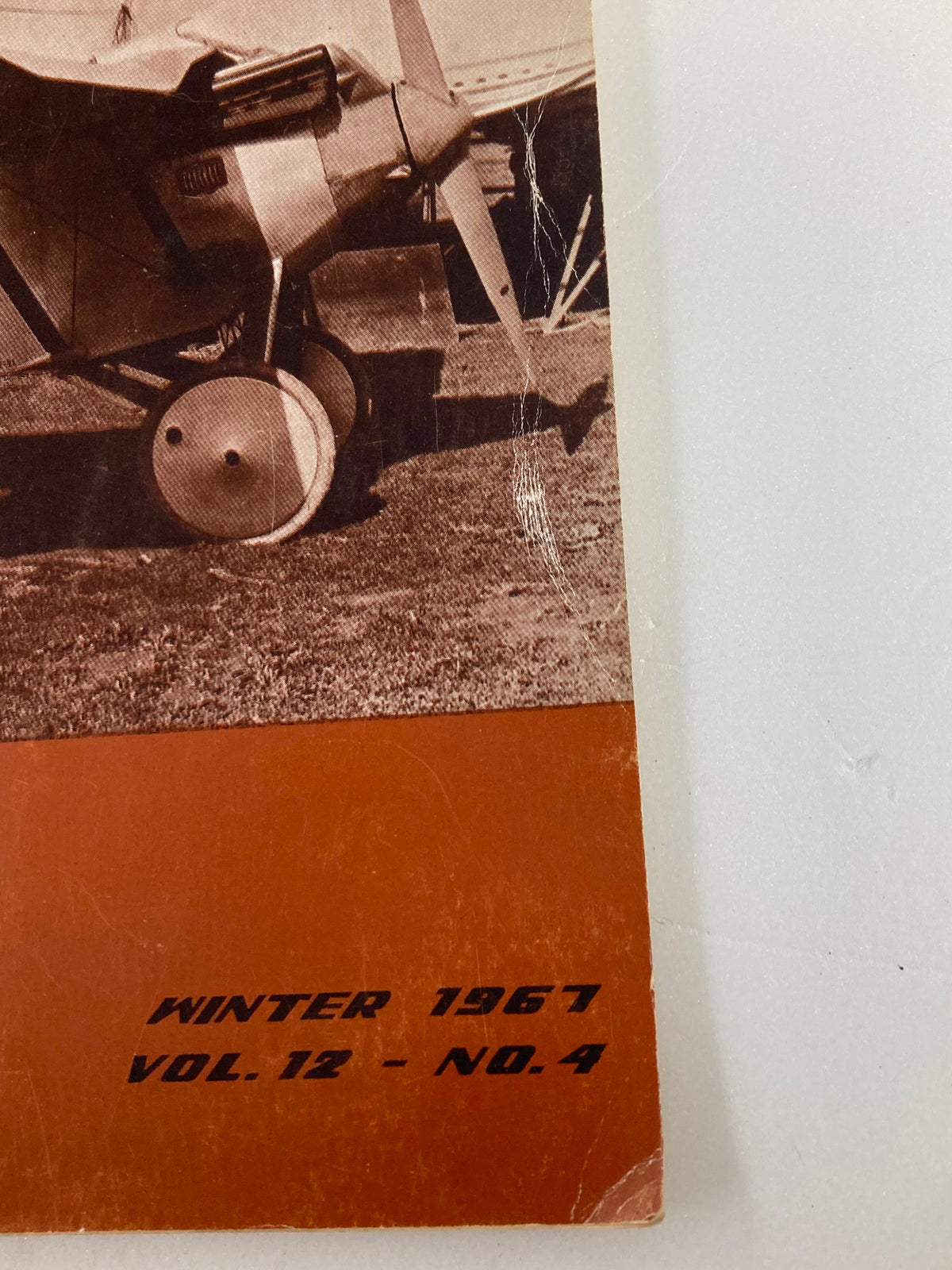 Close-up view of the cover of VTG American Aviation Historical Society Journal Winter 1967 Vol 12 No. 4 highlighting a vintage aircraft.