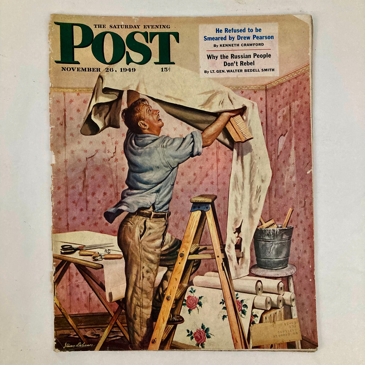 Cover of the Saturday Evening Post Magazine dated November 26, 1949, featuring a man wallpapering a room, showcasing classic 1940s artwork by Charles Dohanos.