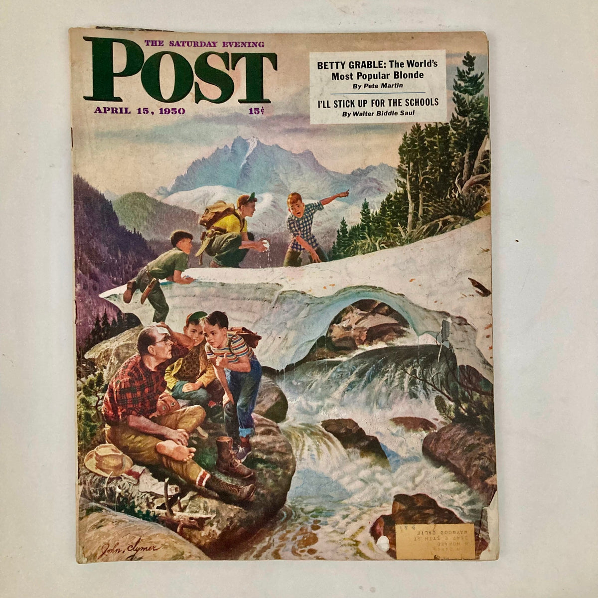 Cover of Saturday Evening Post Magazine from April 15, 1950 featuring artwork by John Clymer showcasing Teanaway Canyon. The cover depicts a picturesque mountain landscape with children playing in nature.