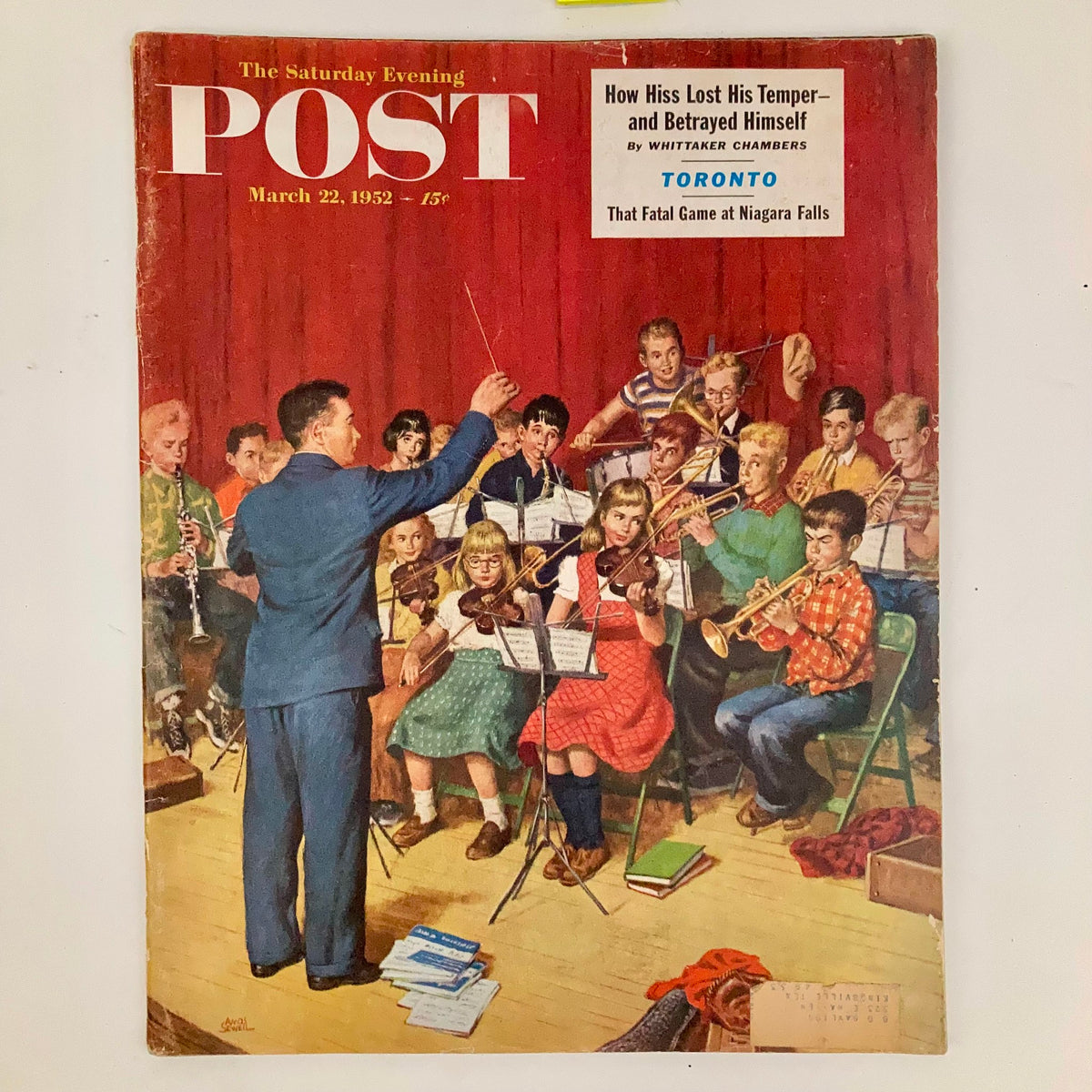 Cover of the Saturday Evening Post Magazine March 22, 1952 featuring a conductor leading a children's orchestra, beautifully illustrated to reflect mid-20th century Americana.