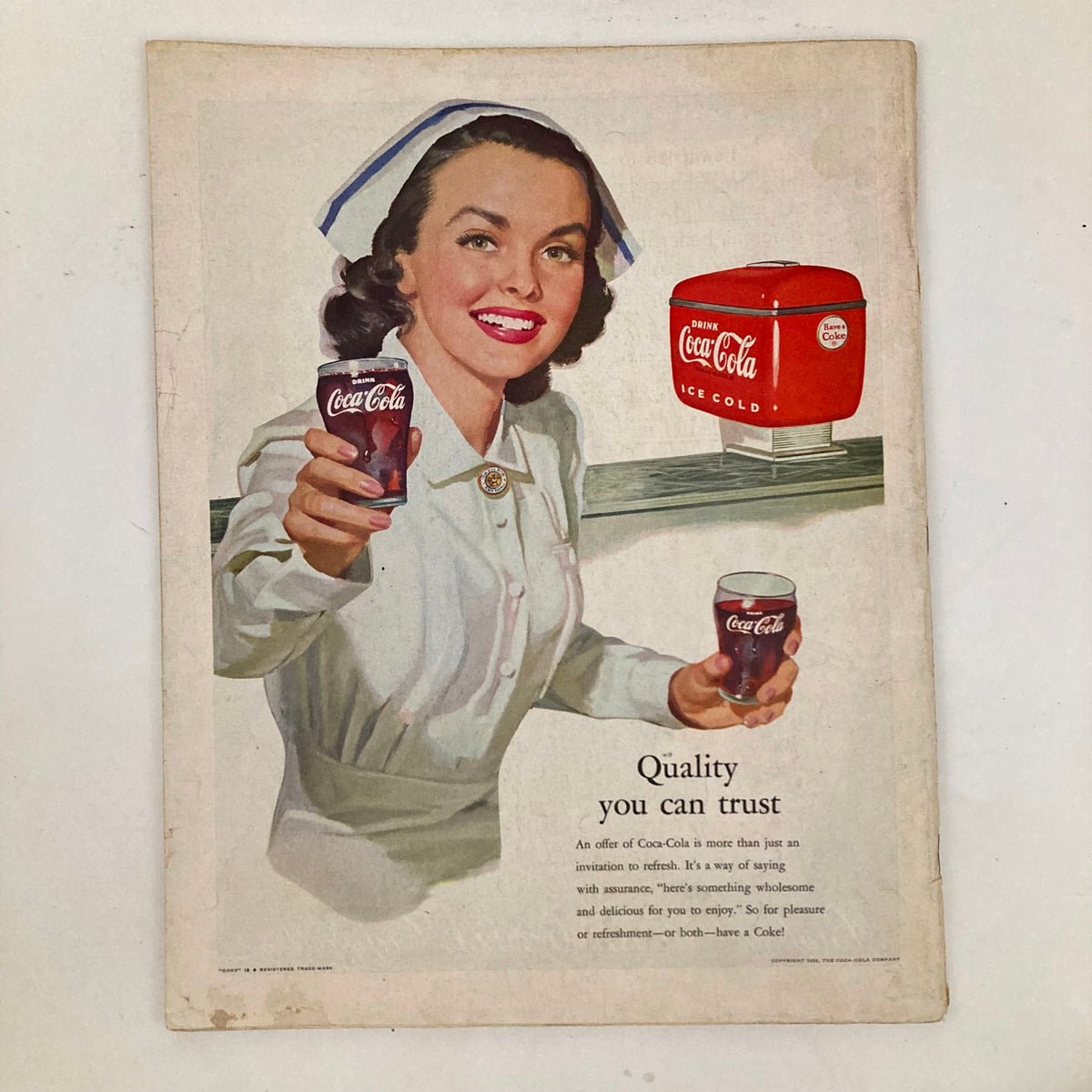 Saturday Evening Post Magazine March 22 1952 featuring a classic Coca-Cola advertisement with a woman presenting drinks, reflecting 1950s Americana.