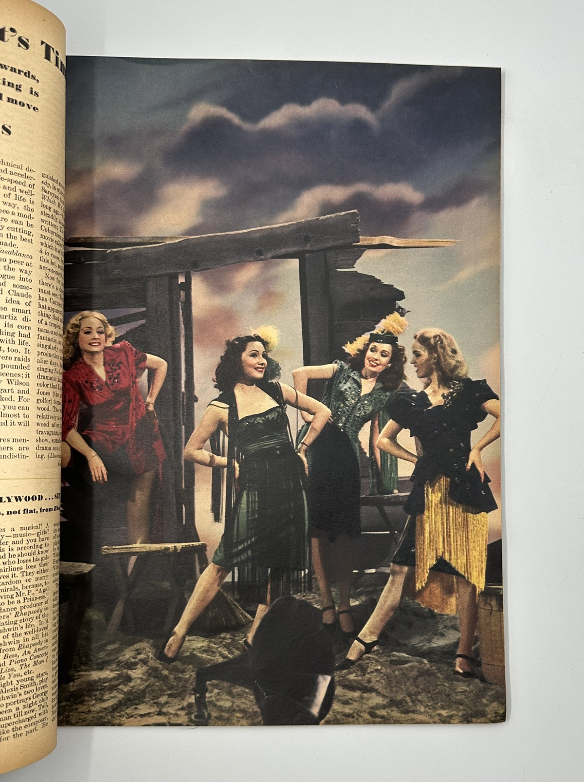 Stylized photo of four women dressed in vibrant, trendy outfits from Esquire Magazine June 1944, highlighting fashion trends of the 1940s era.