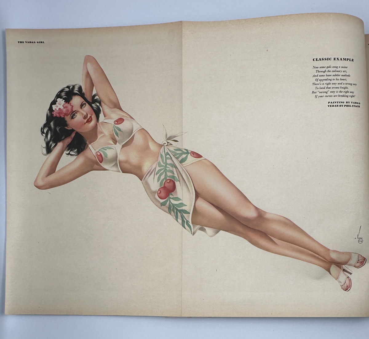 Foldout pinup illustration from Esquire Magazine July 1945, titled 'Classic Example', depicting a glamorous woman in a bathing suit with tropical motifs.