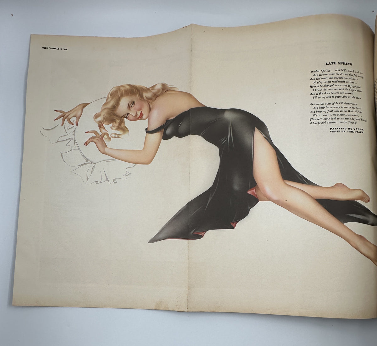 Varga foldout artwork featuring a glamorous pinup girl in a black dress from Esquire Magazine May 1945, showcasing the artistic style of Boris Artzybasheff.