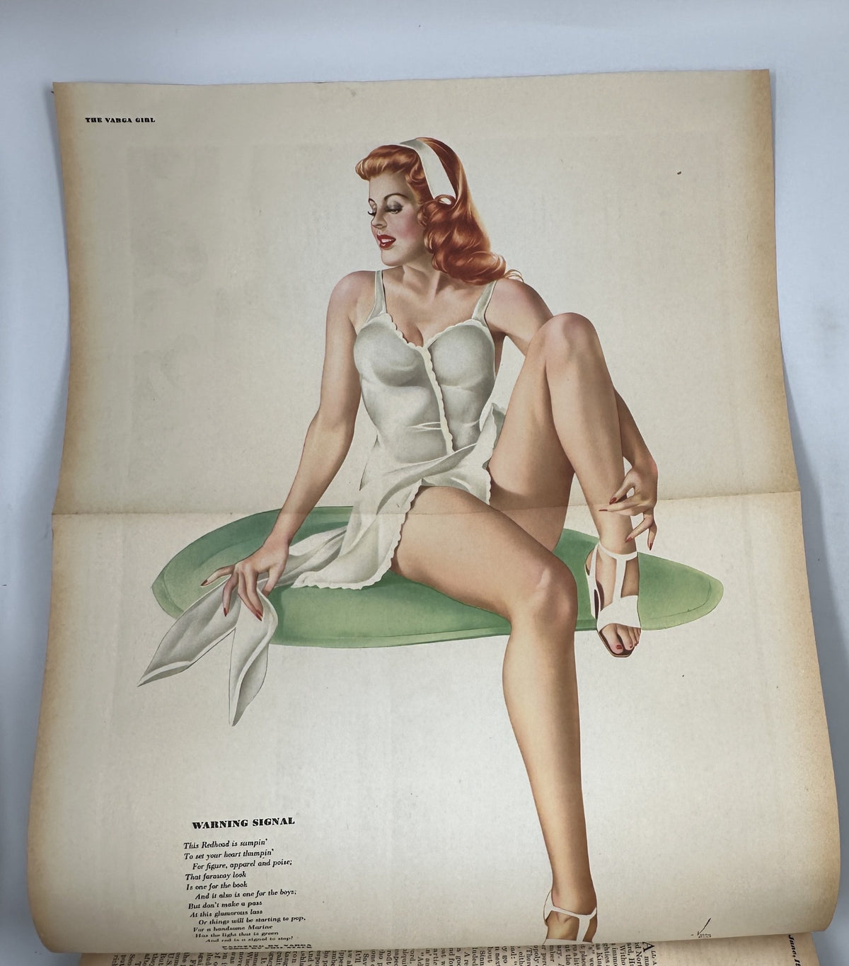 Varga foldout from Esquire Magazine June 1945 depicting the iconic Varga Girl, emphasizing vintage pinup art and style.