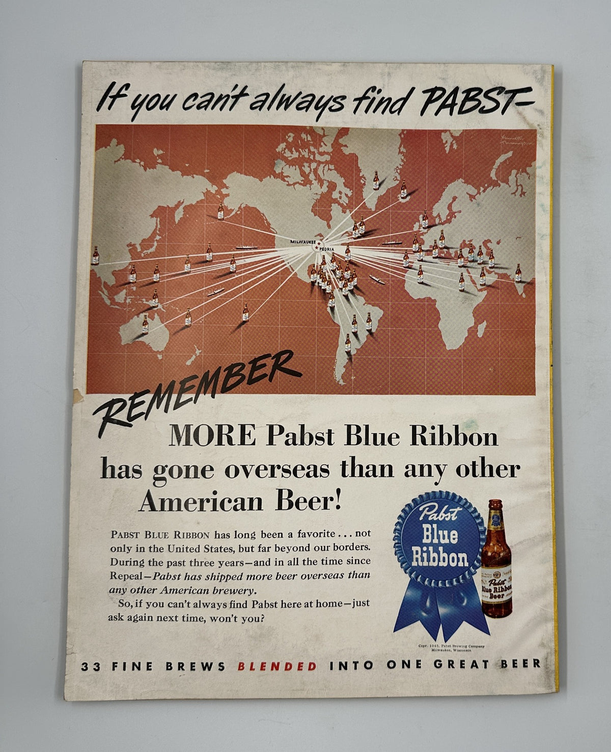 Advertisement page from Esquire Magazine September 1945 promoting Pabst Blue Ribbon beer, highlighting its international distribution with a world map and branding elements.