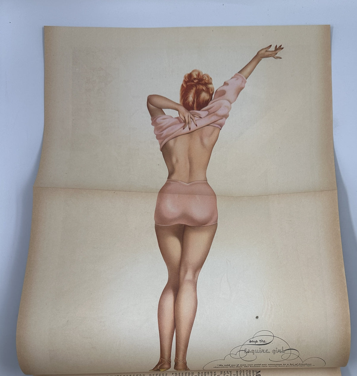Pinup foldout from Esquire Magazine May 1946 featuring a model in a posed silhouette, emphasizing the magazine's classic pinup style.