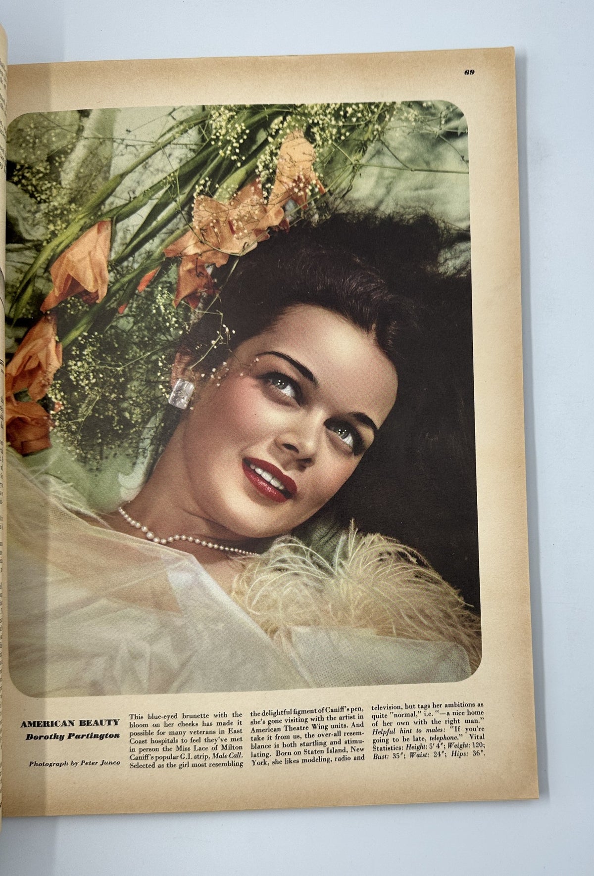Esquire Magazine May 1946 photographic feature titled 'American Beauty' showcasing a glamorous woman with flowers, highlighting classic beauty and elegance.