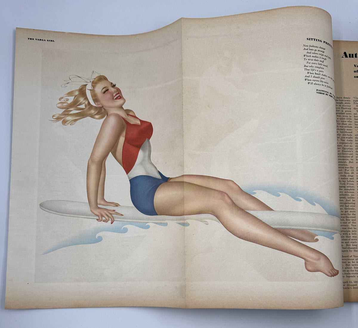 Esquire Magazine August 1944: Varga Foldout featuring a pinup girl in a red, white, and blue swimsuit, sitting on a surfboard against ocean waves.