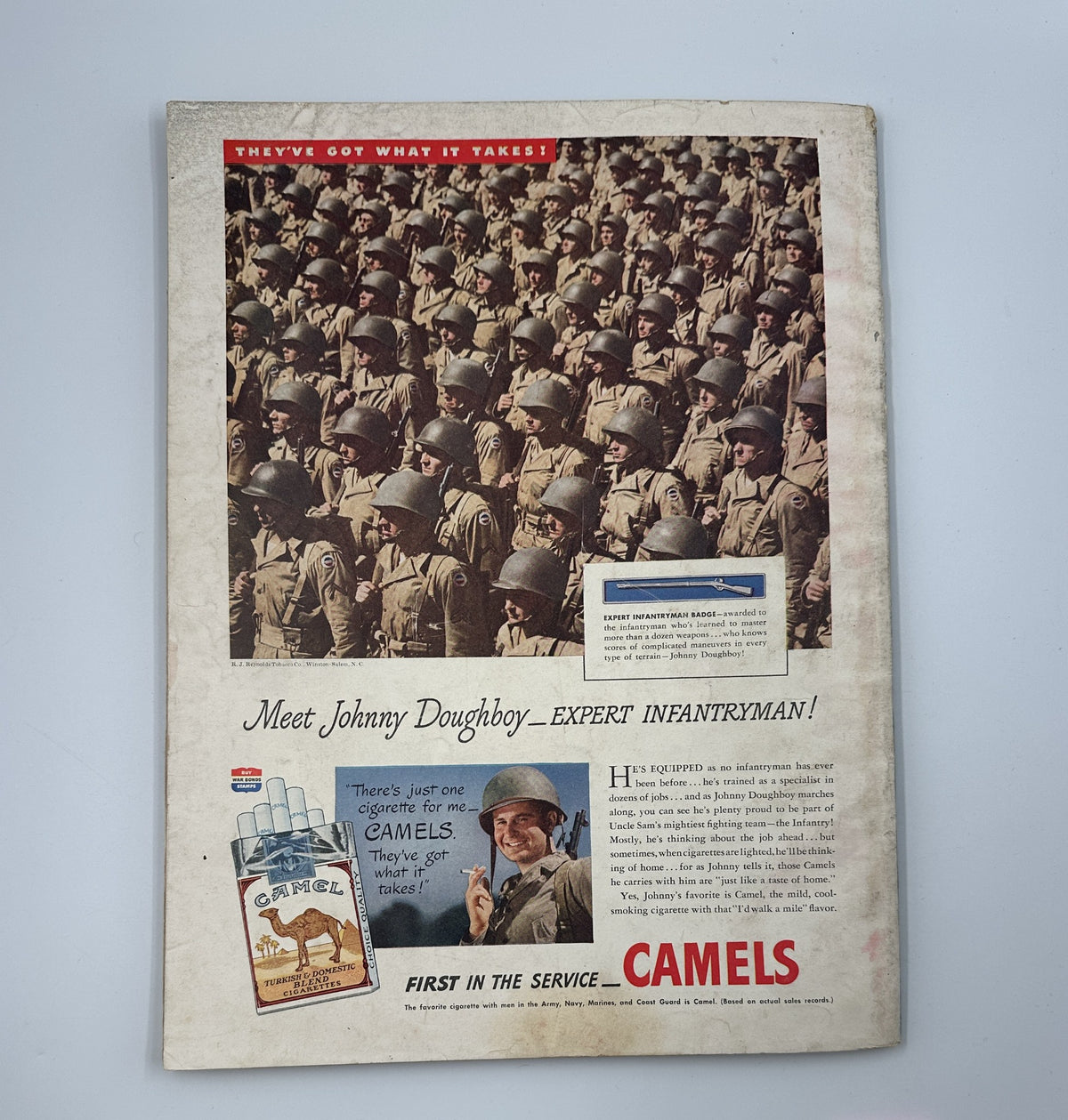 Esquire Magazine August 1944: A vintage advertisement showcasing a regiment of soldiers, promoting Camels cigarettes with the slogan 'Meet Johnny Doughboy - Expert Infantryman!'