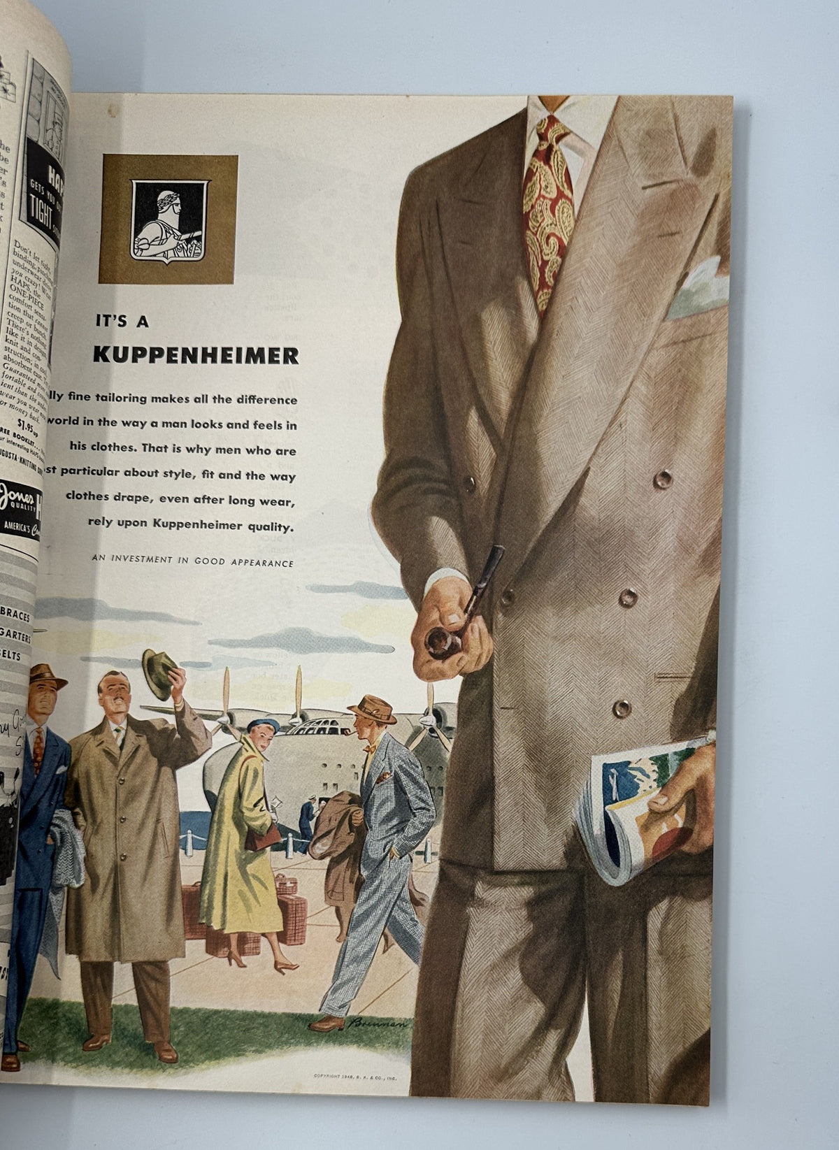 Advertisement for Kuppenheimer featuring elegant men in tailored suits in Esquire Magazine April 1948, illustrating fine men's fashion.