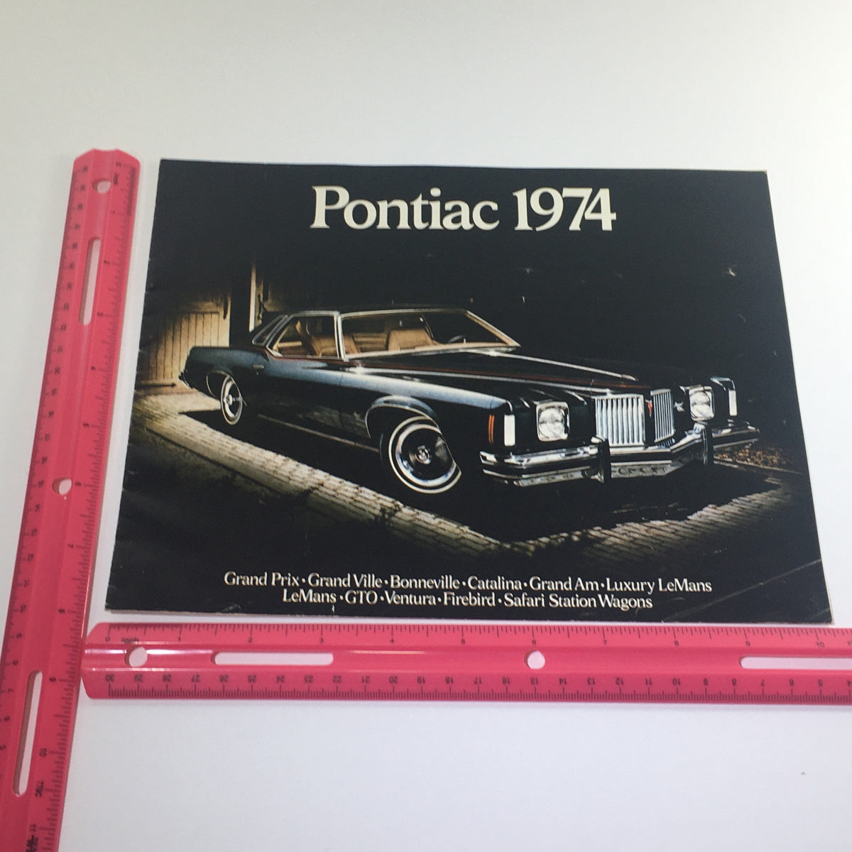 1974 Pontiac Grand Ville 4-Door Hardtop V-8 Sedan Car Auto Catalog Brochure showcasing a vintage Pontiac vehicle with model details from the 1974 lineup.