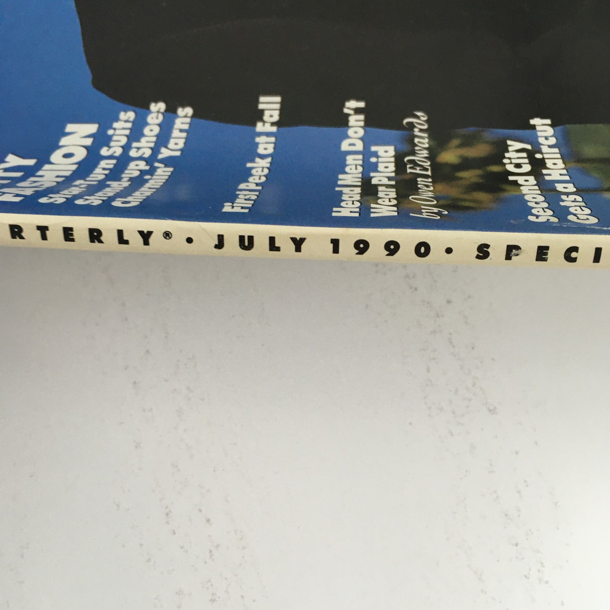 Side view of GQ Magazine July 1990 highlighting the publication name, date, and special issue designation, focusing on themes of witty fashion and notable comedy features.