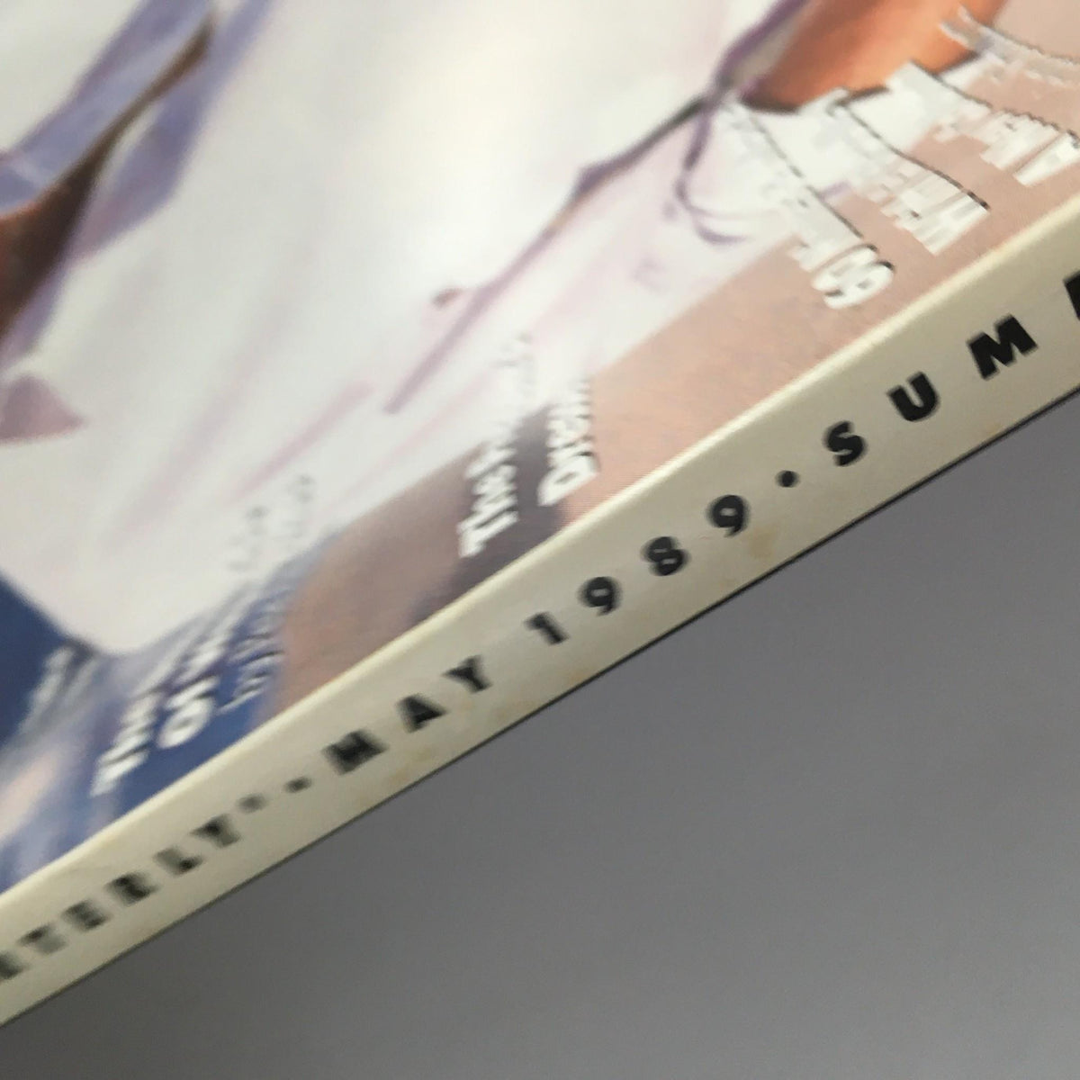 Spine view of GQ Magazine May 1989, highlighting the publication date and features on summer style and celebrity culture.