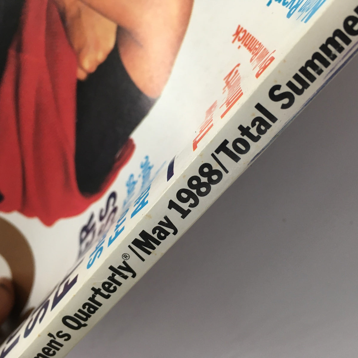 Cover edge of GQ Magazine May 1988 featuring Greg Louganis and Nolan Ryan. The magazine showcases iconic moments in sports and fashion, perfect for collectors.