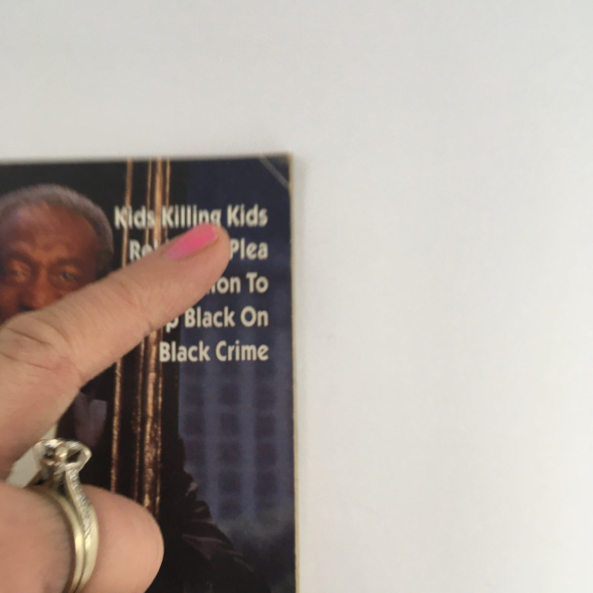 Close-up of the Jet Magazine cover from September 26, 1994, featuring a headline about crime, with a finger pointing at the text, titled 'Jet Magazine September 26 1994 Bill Cosby New Mystery Series with Lynn Whitfield'.