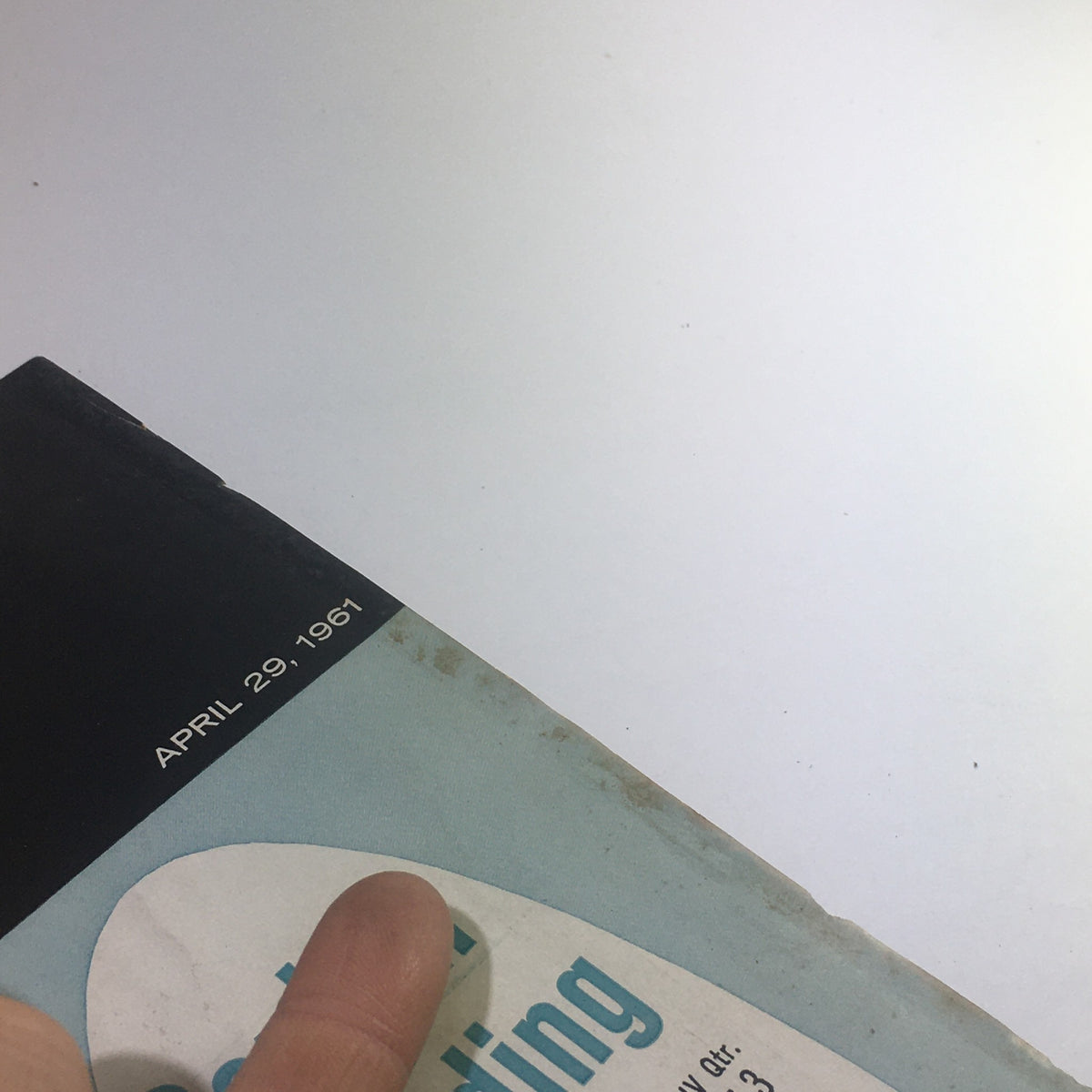 Top edge of Business Week Magazine: April 29, 1961 - Capital Spending Starts To Climb highlighting the publication date and minor wear on the cover.