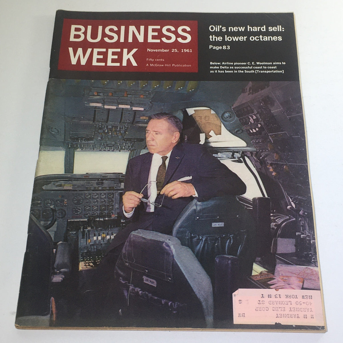 Business Week Magazine cover from November 25, 1961 featuring airline pioneer C.E. Woolman of Delta Airlines, showcasing the cockpit of an aircraft with Woolman seated, highlighting the dawn of commercial aviation.