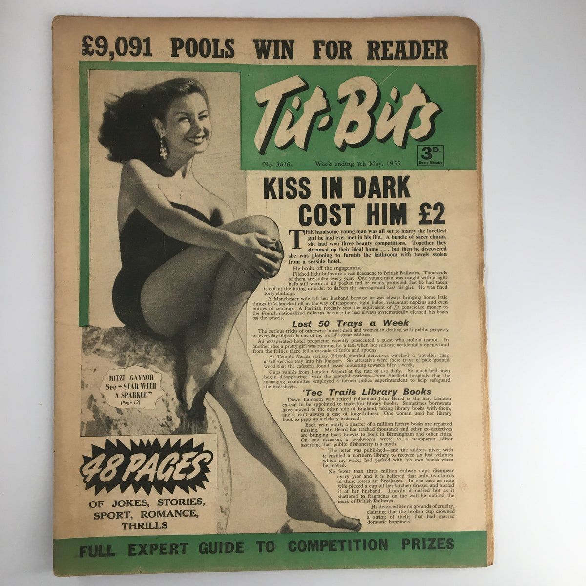 Front cover of VTG Tit-Bits Magazine from May 7, 1955 featuring Mitzi Gaynor, with the title prominently displayed. The magazine highlights an enticing article, 'Kiss in Dark Cost Him £2' and showcases the vintage design indicative of 1950s pop culture.