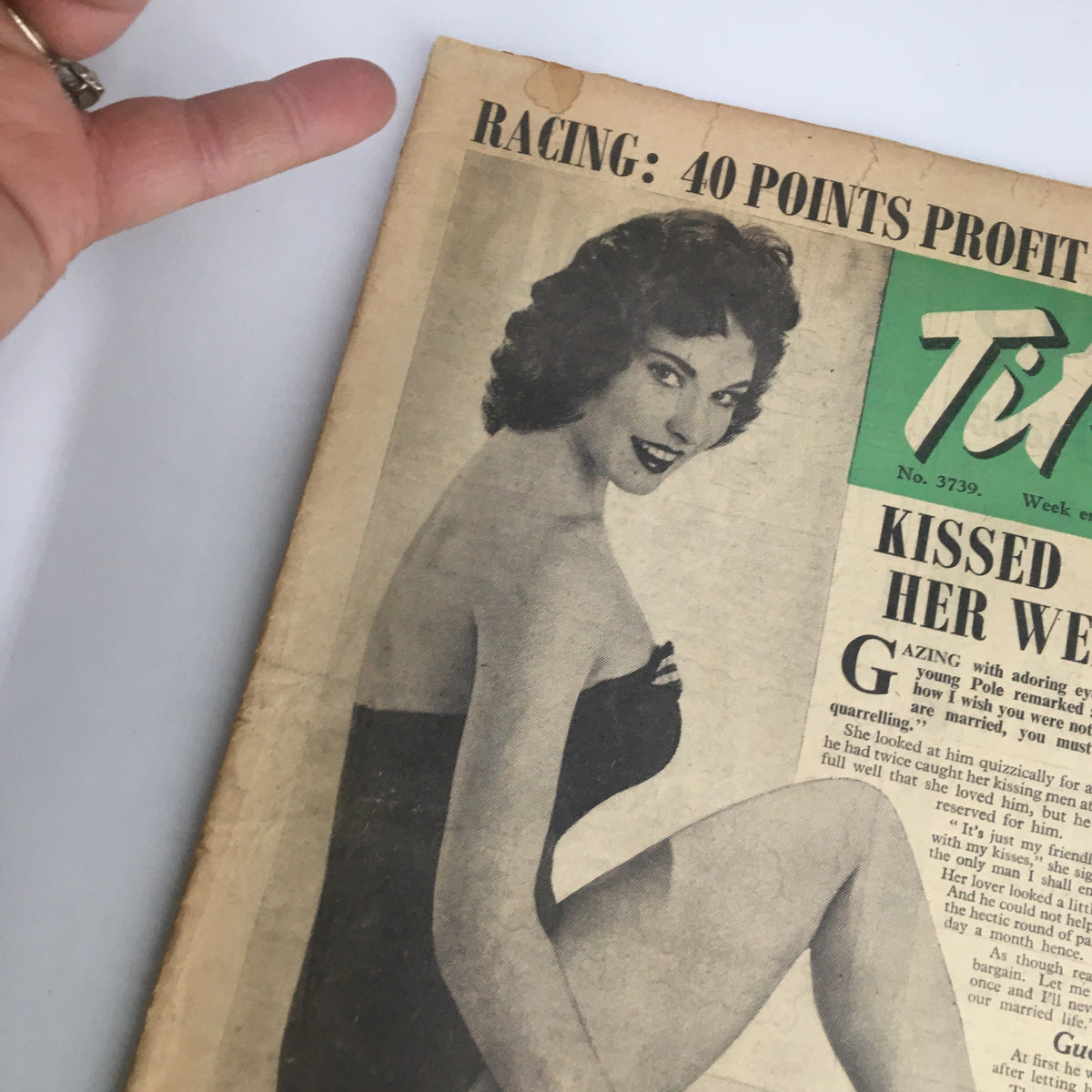 Close-up view of the front cover of VTG Tit-Bits Magazine August 31, 1957, displaying June Russell. The cover highlights the magazine's retro aesthetic and features an article about kissed 300 men on her wedding day.