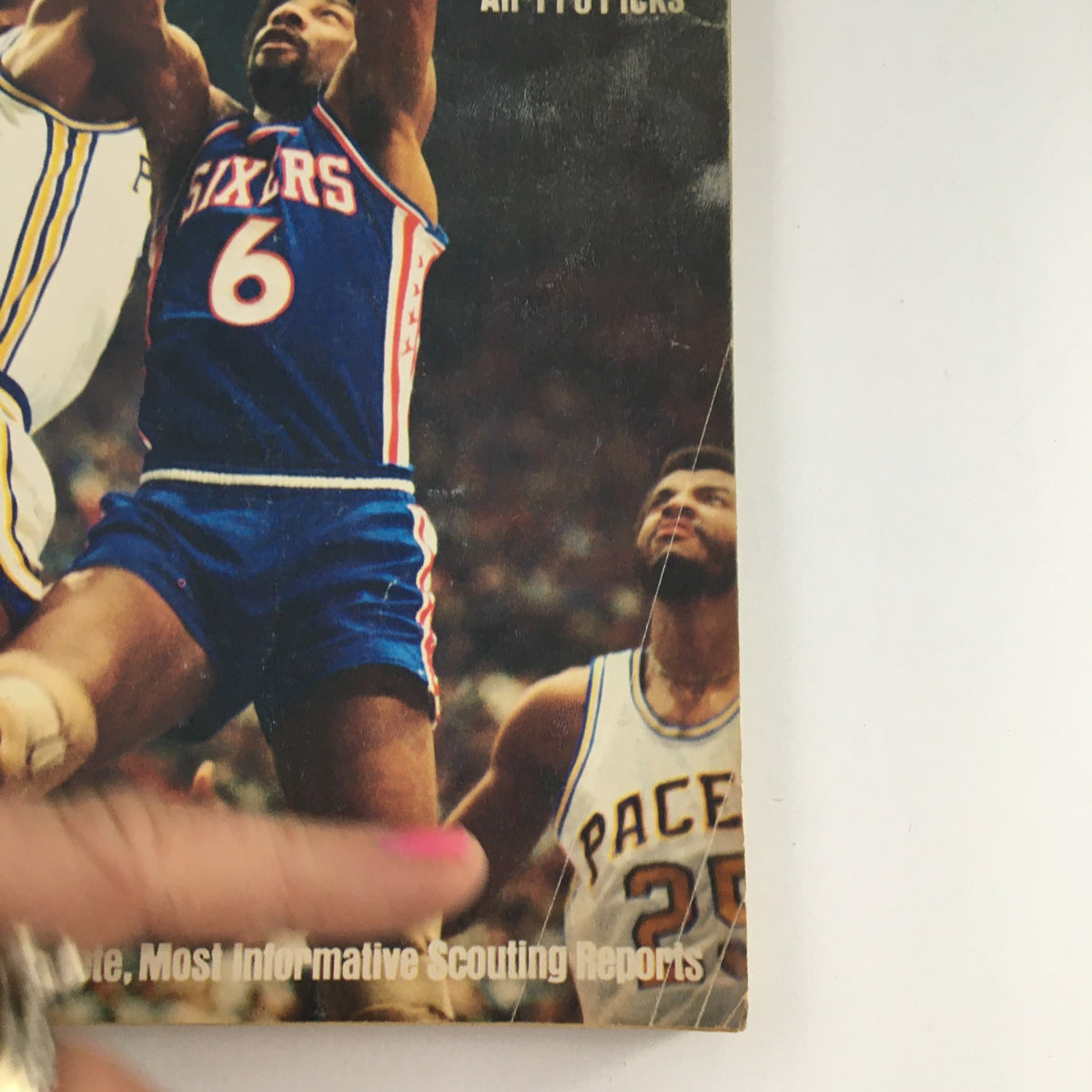 Close-up image of the cover of Street & Smith's Official College & Pro, Prep Yearbook 1977-78 Julius Erving. Features dynamic basketball scene with player jerseys and the word 'Basketball'.