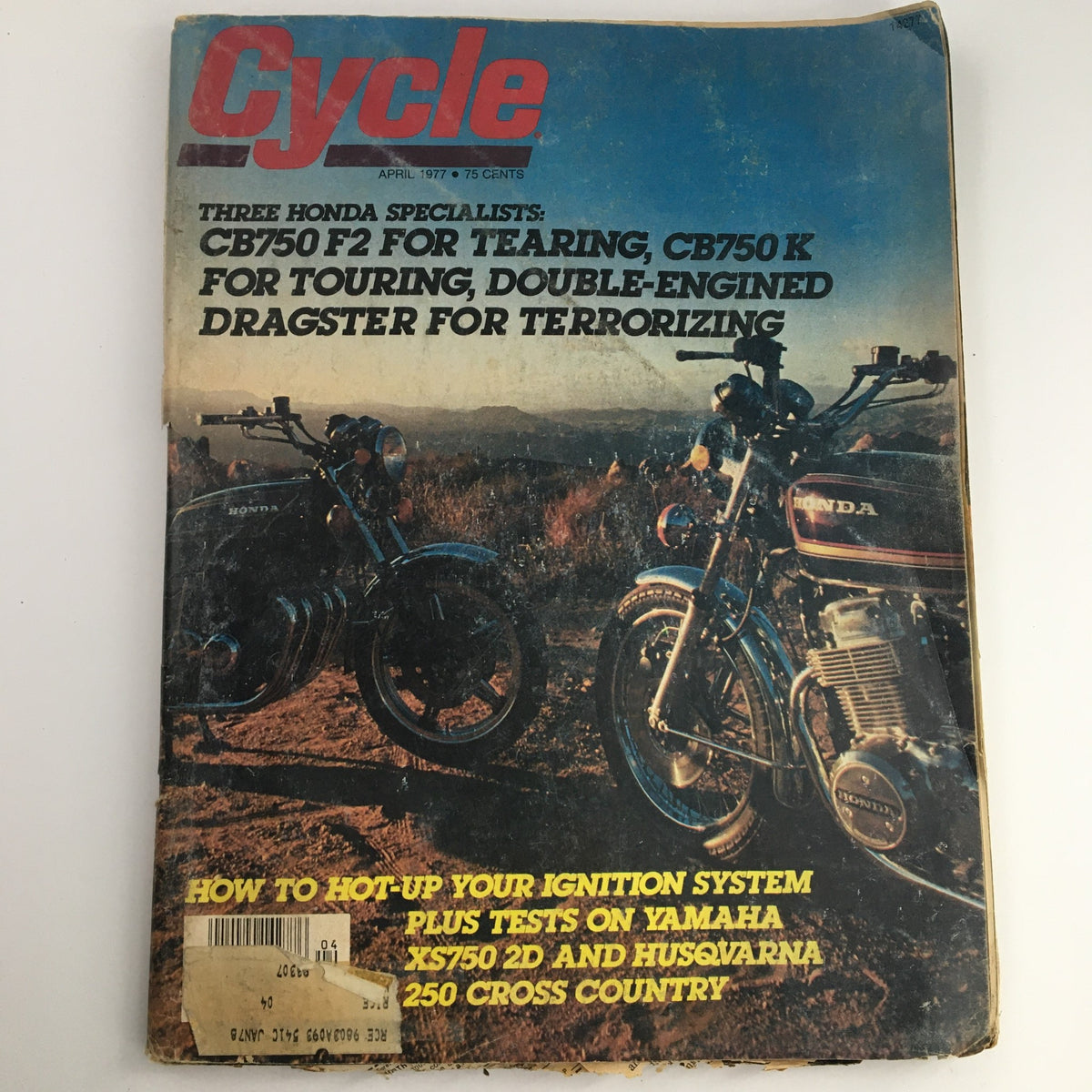 Cycle Magazine April 1977 featuring Honda CB750 F2 and CB750 K alongside Yamaha XS750 and Husqvarna 250. Cover showcases classic motorcycle models with an outdoor backdrop.