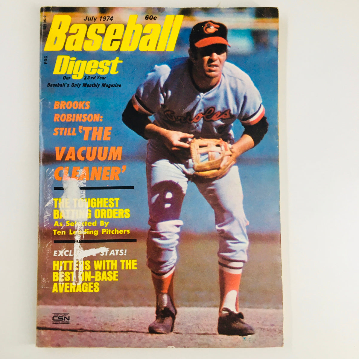 Vintage Baseball Digest Magazine from July 1974 featuring Brooks Robinson on the cover, known as 'The Vacuum Cleaner', showcasing baseball history.
