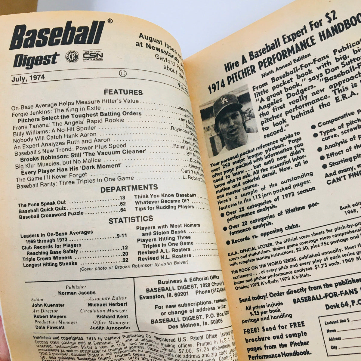 Interior page of July 1974 Baseball Digest Magazine highlighting Brooks Robinson with articles and statistics related to baseball.