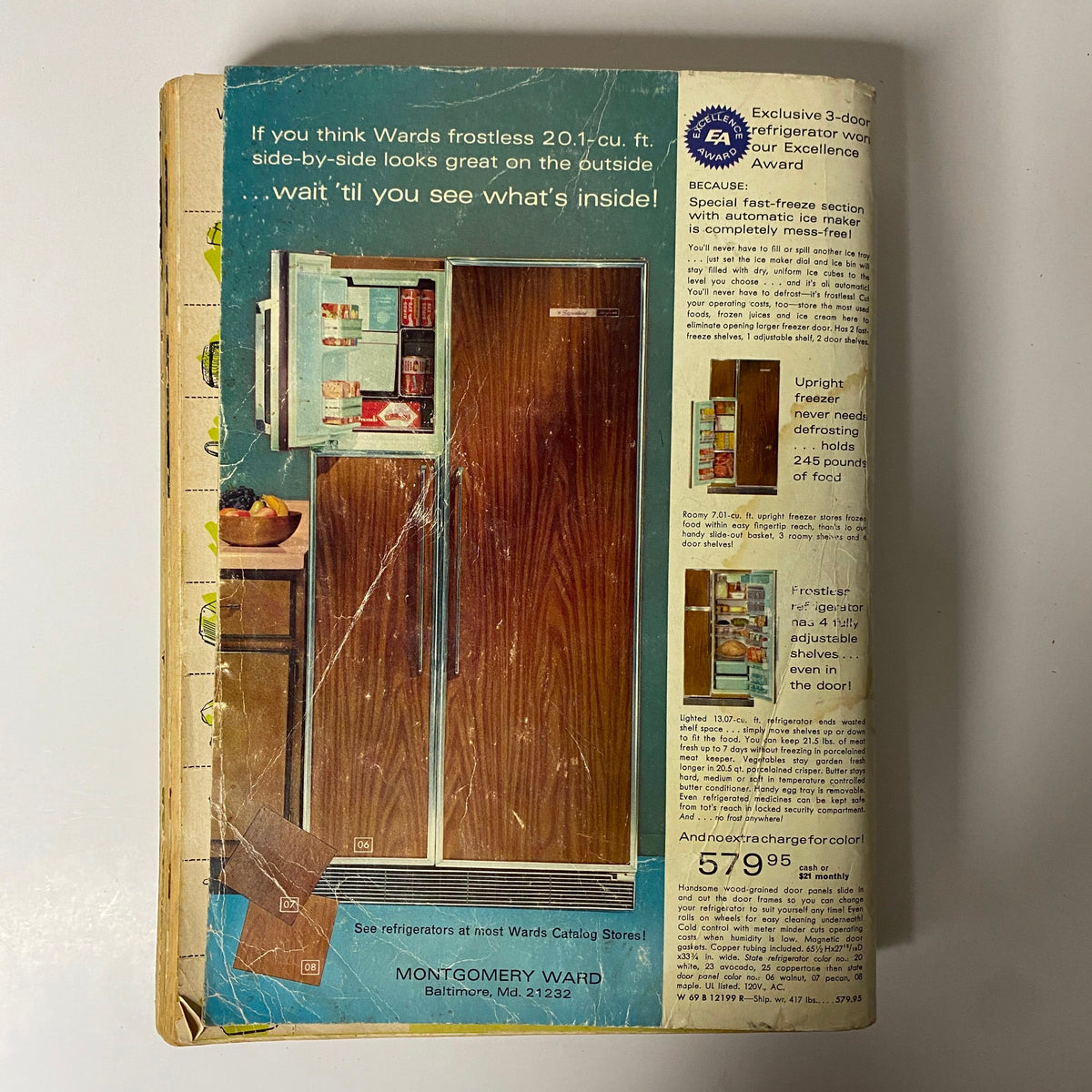 1969 Montgomery Ward Spring and Summer Catalog illustrating the back cover, featuring a side-by-side refrigerator and details about its features, a classic home appliance of the era.