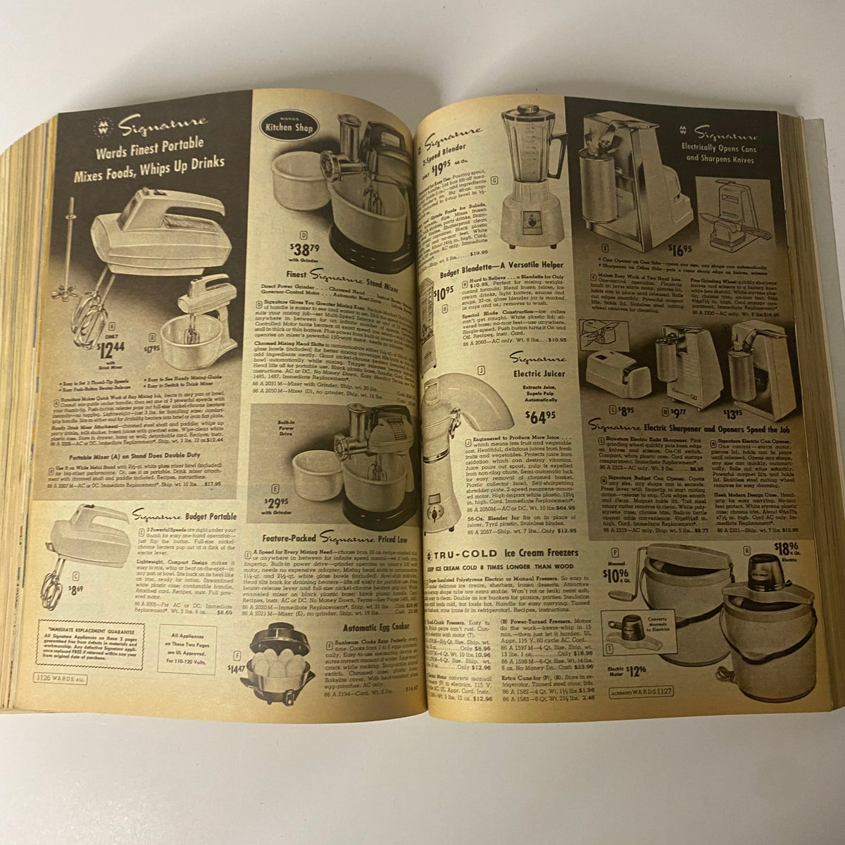 1962 Montgomery Ward Fall and Winter Catalog displaying kitchen appliances including mixers and blenders, emphasizing innovative household products from the 1960s.