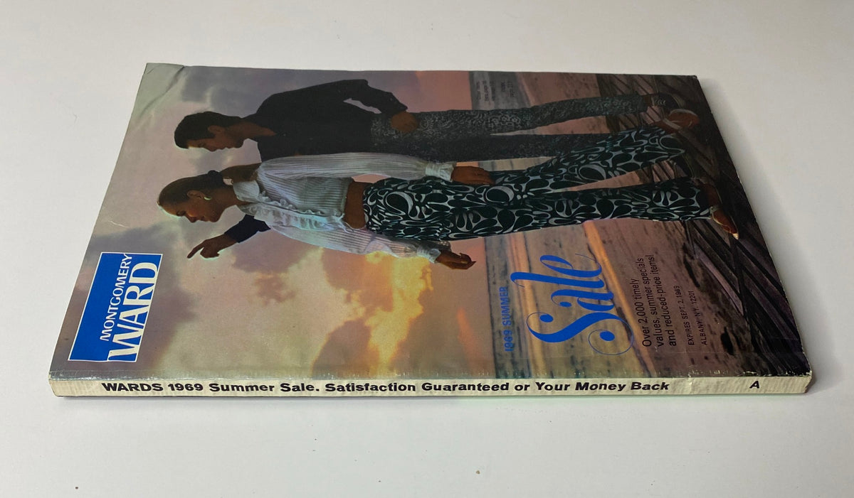 Side view of the 1969 Montgomery Ward Summer Catalog displaying its stylish cover with the title 'WARDS 1969 Summer Sale' and vibrant fashion imagery.