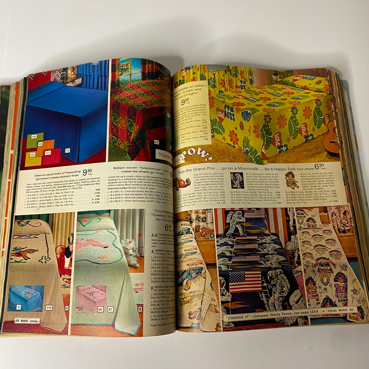 Page from the 1970 Montgomery Ward Spring and Summer Catalog showing vibrant tablecloth designs and household goods, capturing the eclectic style of the early 1970s.