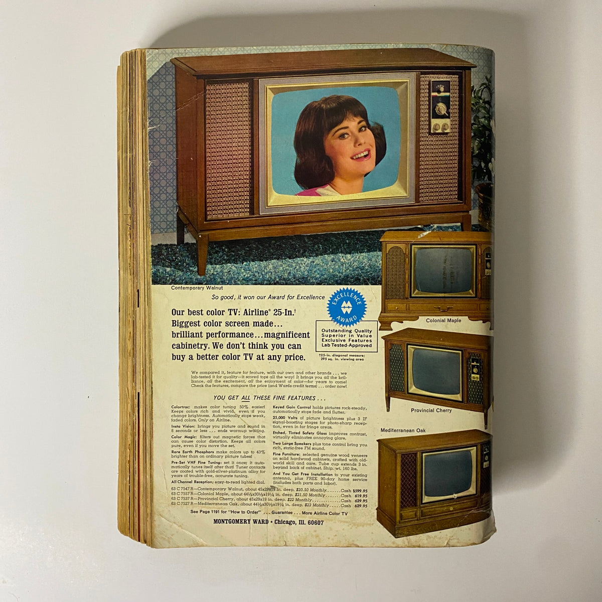 1966 Montgomery Ward Fall and Winter Catalog displaying a vintage 25-inch color television set with a woman in front of the screen, highlighting its features on a nostalgic advertisement.