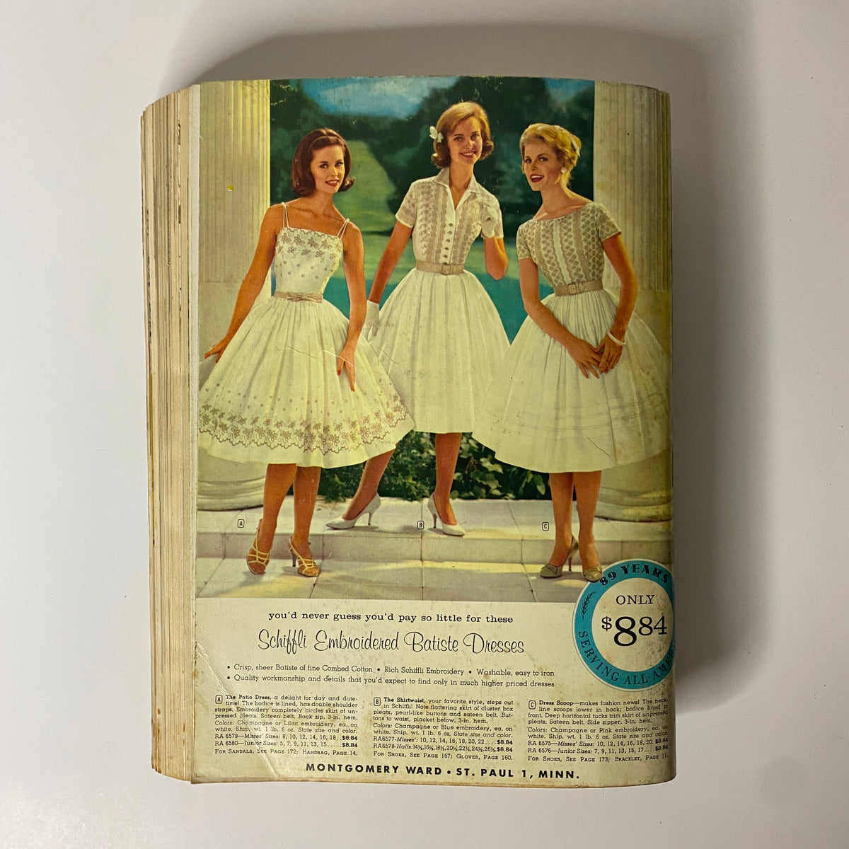 Cover page of 1961 Montgomery Ward Spring and Summer Catalog featuring fashionable young women in embroidered batiste dresses, showcasing vintage clothing styles.