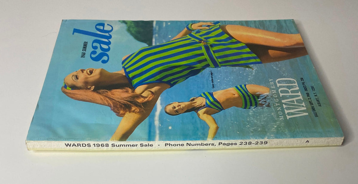 Side view of the 1968 Montgomery Ward Summer Catalog showing the cover with two models in striped swimwear, capturing the essence of 1960s summer fashion.