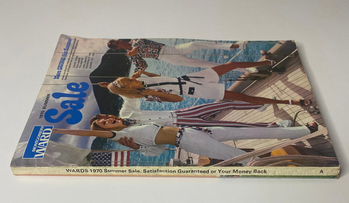 Side view of the 1970 Montgomery Ward Summer Catalog displaying the cover design with models in summer attire.