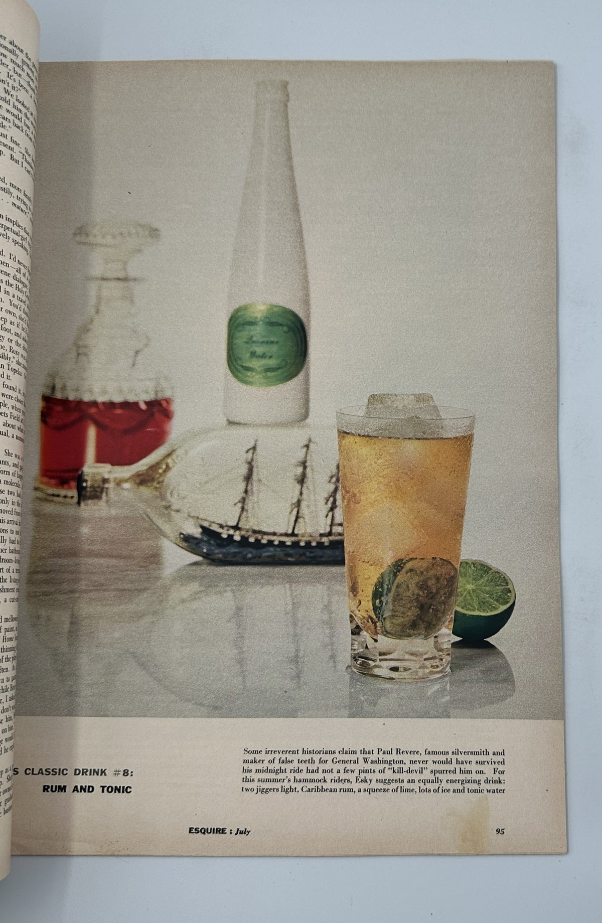 Esquire Magazine July 1956 Classic Drink No. 8 featuring a refreshing Rum and Tonic drink with lime. The image showcases a sophisticated presentation with a glass of the cocktail and a decorative bottle in the background.